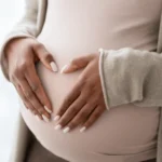 Expectant mom holding bump. Stock images sourced from getty.
